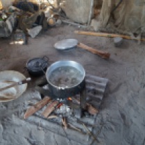 Making pap - the daily meal for people in Mayana made from Mahangu